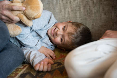 Parents having fun with little preschooler sonの写真素材