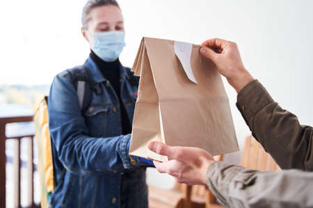 Courier delivered the order bag with food to the client