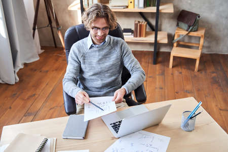 Businessman in eyewear working with computer
