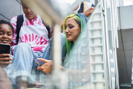 People watching video clips at the smartphone while searching new trends