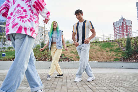 Group of friends dancing on city areaの写真素材