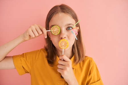 European little girl closed eye with lollipop
