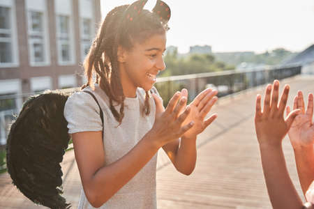 Little black girls playing pat-a-cake at halloweenの写真素材
