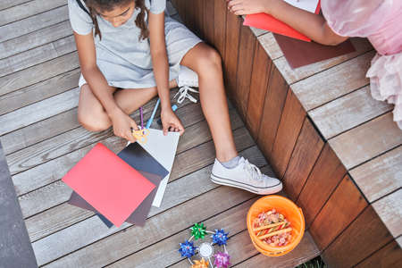 Little black girls crafting something at halloweenの写真素材