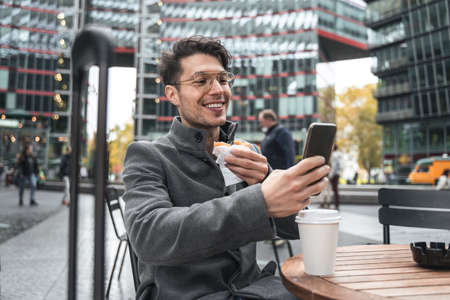 Man looking at the smartphone camera and chatting with somebody via video call