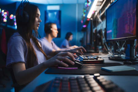 Professional cybersport players training or playing online video game on PC late at nightの写真素材
