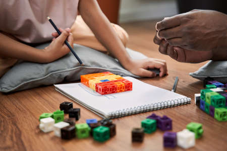 Father and his daughter playing at the constructorの写真素材