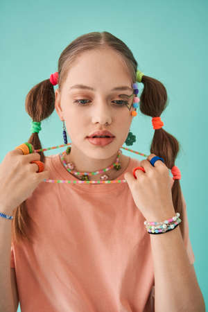 Dreamy young lady with perfect skin and bright accessorizes portrait