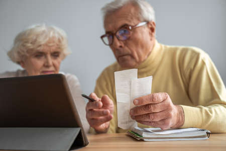 Concentrated senior couple planning budget, refund or mortgage approvalの写真素材