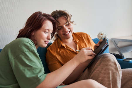 Overjoyed couple of  girls having fun togetherの写真素材