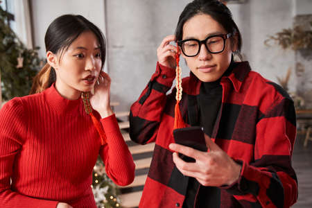 Chinese loving couple making self portrait at the smartphoneの写真素材