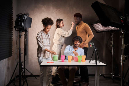 Man and woman chatting with each other at the table with kinetic sandの写真素材