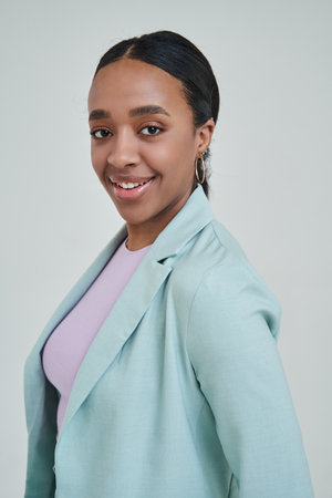 Brunette multiracial woman looking attentively at the cameraの写真素材