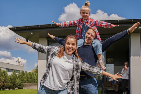 Portrait happy family posing at camera togetherの写真素材