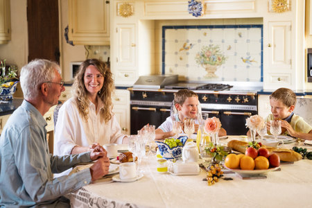 Family having healthy breakfast at home in the morninの写真素材