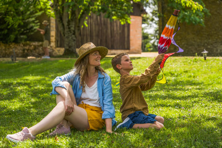 Full length view of the caucasian mother playing with her little son in the parkの写真素材
