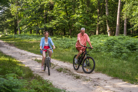 Senior man and his daughter enjoying of the summer natureの写真素材