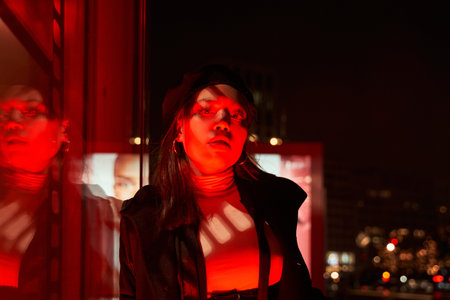 Female teenager fashion model at night city light glowの写真素材