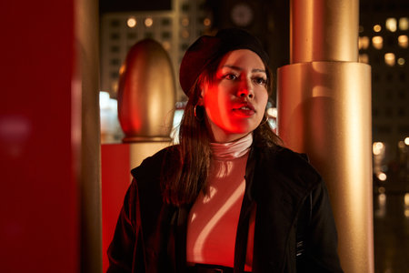 Brunette haired young woman tourist with light makeup looking around standingの写真素材