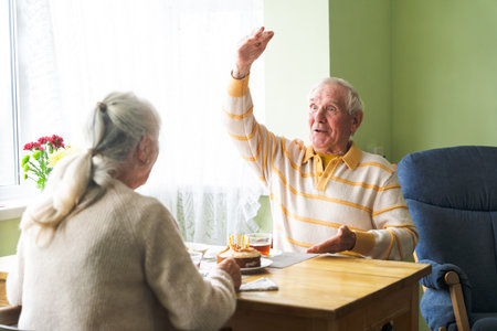 Happy old couple at home