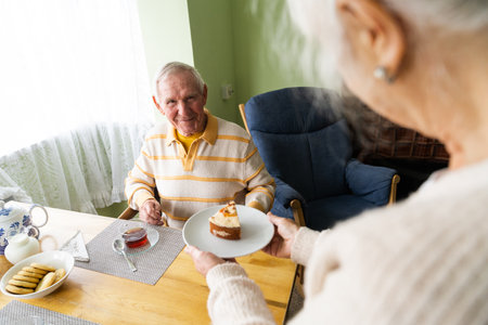 Happy old couple at homeの写真素材