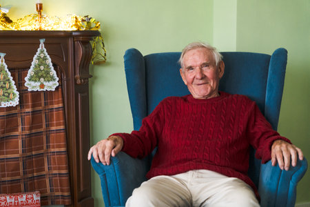 Happy old grandfather at his home.の写真素材