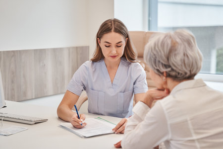 Professional doctor physician consulting old female patientの写真素材