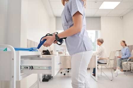 Cropped view of the woman doctor taking stethoscope for checking blood pressureの写真素材
