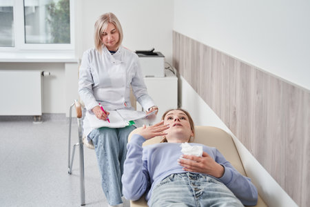 Emotional woman complaining about her problems to her qualified psychotherapistの写真素材