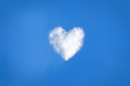 abstract heart shaped cloud on blue sky backgroundの写真素材