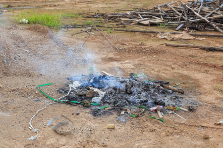 burning garbage with white smokeの写真素材
