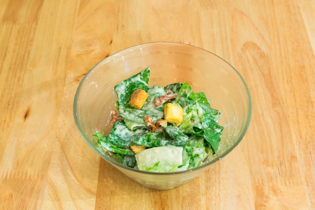 Caesar salad in glass bowlの写真素材