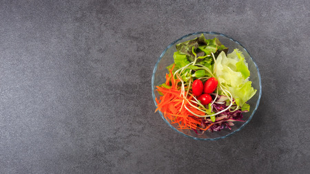 Fresh salad on grey stone backgroundの写真素材