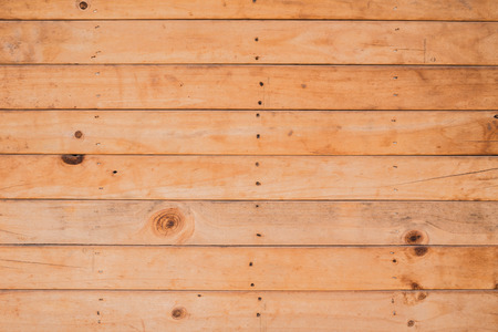 wooden background with nail and knots holeの写真素材