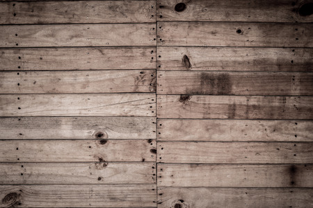 wooden background with nail and knots holeの写真素材