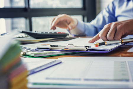 Administrator business man financial inspector and secretary making report, calculating or checking...