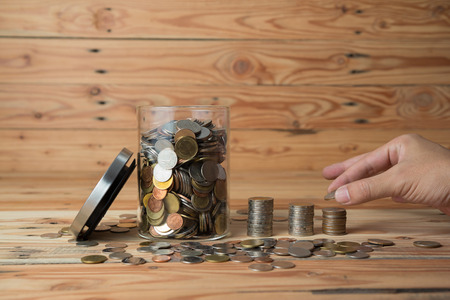 Saving money concept - money coin stack growing business