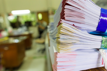 Pile of unfinished a bundle documents on office desk, Stack of business paperの写真素材