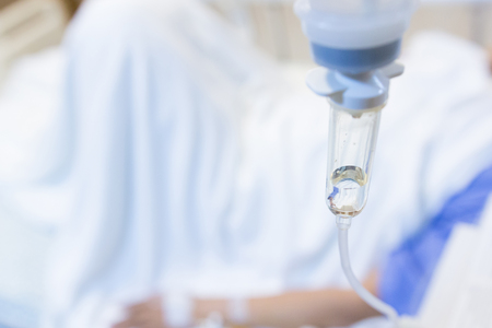 Female patients take saline intravenous in the hospital.- Health care conceptの写真素材