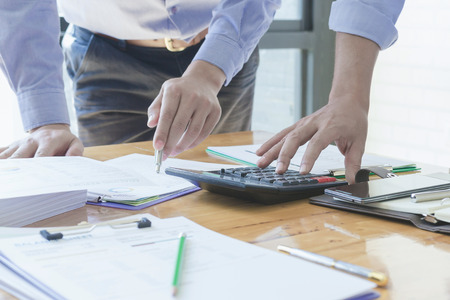 Administrator business man financial inspector and secretary making report, calculating or checking balance. - Business Conceptの写真素材