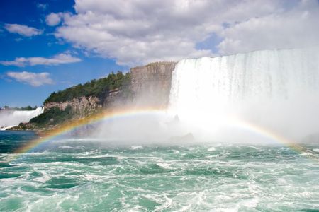 rainbow over the american side of niagara falls.の写真素材