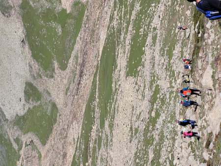 Climbers descend from the top of the mountain. Extreme sport.の写真素材