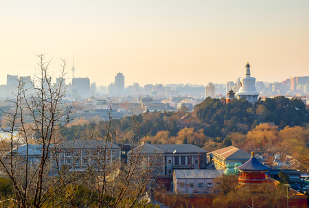 View over Beihai park in late afternoon with Beijing skyline as a backgroundの写真素材