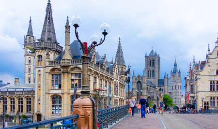 Ghent, Belgium-June 12, 2016: The street view of the old town with St. Nicholas' church and historical buildings on cloudy day in Ghentのeditorial素材