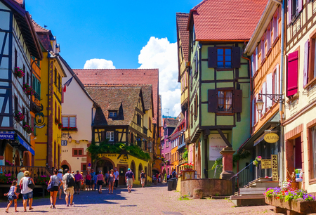 Riquewihr, France-June 23, 2016: Tourists are walking on the main shopping street; Rue du General de Gaulle, in Riquewihr, Alsace wine roadのeditorial素材