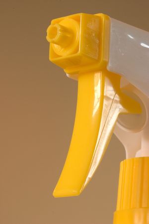 Yellow spray nozzle, macro of the nozzle and trigger.
