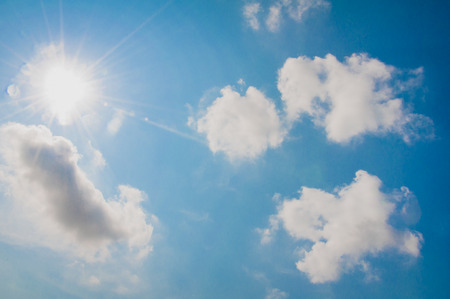 clouds and sun in the blue sky
