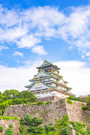 Japan - July 15, 2019 : Main Building of Osaka Castle with Green Trees around castle in summer, Osakaのeditorial素材