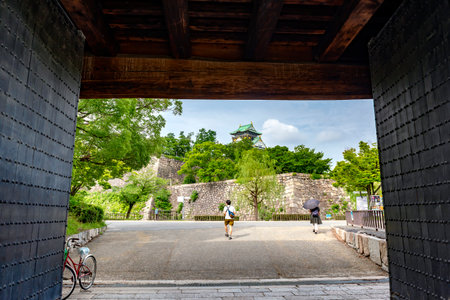 Japan - July 19, 2019 : Tourists walking through Main Gate of Osaka Castle Park with Osaka Castle Backgroundのeditorial素材