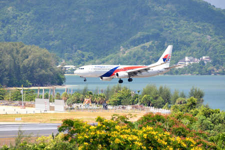 Thailand - April 19, 2019 : Malaysia Airline landing at Phuket International Airport, Phuketのeditorial素材